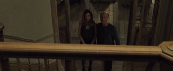 Movie still from “Mother!” (2017), directed by Darren Aronofsky – A man and a woman standing next to each other in a room; Medium shot, High angle