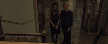 Movie still from “Mother!” (2017), directed by Darren Aronofsky – A man and a woman standing next to each other; Medium shot, High angle