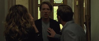 Movie still from “Mother!” (2017), directed by Darren Aronofsky – A man is talking to another man in front of a window; Medium shot, Over the shoulder angle