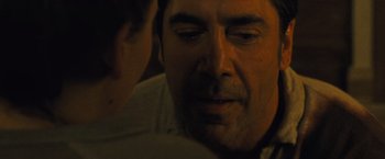 Movie still from “Mother!” (2017), directed by Darren Aronofsky – A man's face as he looks at another man; Close Up shot, Over the shoulder angle
