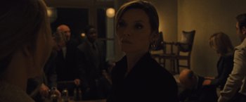 Movie still from “Mother!” (2017), directed by Darren Aronofsky – A woman standing in front of a man in a suit and tie; Close Up shot, Low angle