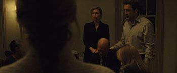 Movie still from “Mother!” (2017), directed by Darren Aronofsky – A group of people standing in a room; Medium shot, Over the shoulder angle