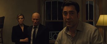 Movie still from “Mother!” (2017), directed by Darren Aronofsky – Two men in suits and ties standing in a room; Close Up shot, Over the shoulder angle