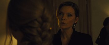 Movie still from “Mother!” (2017), directed by Darren Aronofsky – A woman in a black shirt looking at the camera; Close Up shot, Over the shoulder angle