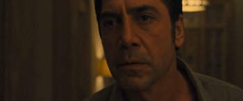 Movie still from “Mother!” (2017), directed by Darren Aronofsky – A man's face in a dark room; Close Up shot, Over the shoulder angle
