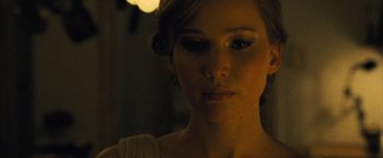 Movie still from “Mother!” (2017), directed by Darren Aronofsky – A woman's face in the dark; Close Up shot, Over the shoulder angle