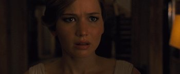 Movie still from “Mother!” (2017), directed by Darren Aronofsky – A woman's face in the dark; Close Up shot, Over the shoulder angle