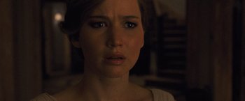 Movie still from “Mother!” (2017), directed by Darren Aronofsky – A person looking at the camera; Close Up shot, Over the shoulder angle