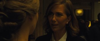 Movie still from “Mother!” (2017), directed by Darren Aronofsky – A woman wearing a suit and earrings talking to another woman; Close Up shot, Over the shoulder angle