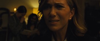 Movie still from “Mother!” (2017), directed by Darren Aronofsky – A woman's face in a dark room; Close Up shot, Over the shoulder angle