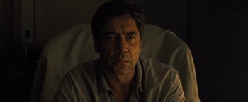 Movie still from “Mother!” (2017), directed by Darren Aronofsky – A person sitting in a chair; Close Up shot, Low angle