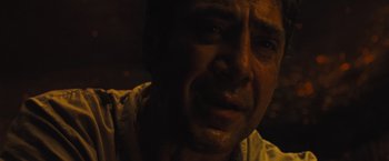 Movie still from “Mother!” (2017), directed by Darren Aronofsky – A man's face in the dark; Close Up shot, Over the shoulder angle