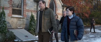Movie still from “Mr. Harrigan's Phone” (2022), directed by John Lee Hancock – A group of people walking in front of a building; Medium shot, Over the shoulder angle