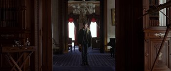 Movie still from “Mr. Harrigan's Phone” (2022), directed by John Lee Hancock – A man in a hat is standing in a room; Wide shot, Low angle