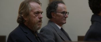 Movie still from “Mr. Harrigan's Phone” (2022), directed by John Lee Hancock – Two men sitting in a room next to each other; Close Up shot, Over the shoulder angle