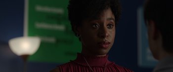 Movie still from “Mr. Harrigan's Phone” (2022), directed by John Lee Hancock – A person wearing a red shirt; Close Up shot, Over the shoulder angle