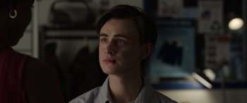 Movie still from “Mr. Harrigan's Phone” (2022), directed by John Lee Hancock – A young man is looking into the distance; Close Up shot, Over the shoulder angle