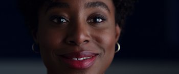 Movie still from “Mr. Harrigan's Phone” (2022), directed by John Lee Hancock – A woman's face with red lipstick; Extreme Close Up shot, Low angle