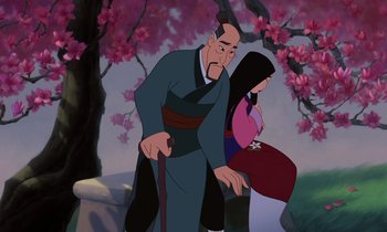 Movie still from “Mulan” (1998), directed by Tony Bancroft – An old man and a young woman are standing next to each other in front of a tree; Medium shot, Over the shoulder angle