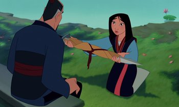 Movie still from “Mulan” (1998), directed by Tony Bancroft – An animated scene of a woman holding a sword; Medium shot, Over the shoulder angle