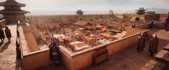 Movie still from “Mulan” (2020), directed by Niki Caro – An outdoor market with many tents and tables; Extreme Wide shot, High angle