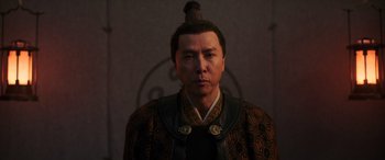 Movie still from “Mulan” (2020), directed by Niki Caro – A man in a traditional chinese outfit; Close Up shot, Low angle
