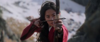 Movie still from “Mulan” (2020), directed by Niki Caro – A young woman is holding a bow and arrow; Close Up shot, Low angle