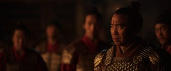 Movie still from “Mulan” (2020), directed by Niki Caro – A group of men standing next to each other; Close Up shot, Over the shoulder angle