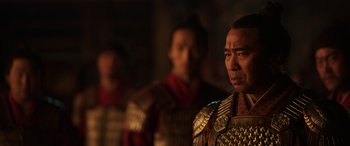 Movie still from “Mulan” (2020), directed by Niki Caro – A group of men standing next to each other; Close Up shot, Over the shoulder angle