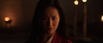 Movie still from “Mulan” (2020), directed by Niki Caro – A woman wearing a red and black kimono; Close Up shot, Low angle
