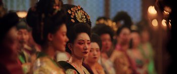 Movie still from “Mulan” (2020), directed by Niki Caro – A group of women in traditional asian clothing; Close Up shot, Over the shoulder angle