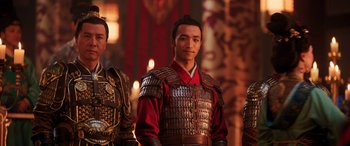 Movie still from “Mulan” (2020), directed by Niki Caro – A group of men standing next to each other; Medium shot, Over the shoulder angle