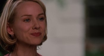 Movie still from “Mulholland Drive” (2001), directed by David Lynch – A woman's face in a pink shirt; Close Up shot, Over the shoulder angle