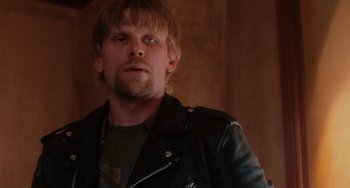 Movie still from “Mulholland Drive” (2001), directed by David Lynch – A person wearing a leather jacket; Close Up shot, Over the shoulder angle