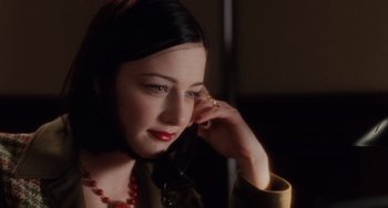 Movie still from “Mulholland Drive” (2001), directed by David Lynch – A beautiful woman talking on a phone; Close Up shot, High angle