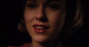 Movie still from “Mulholland Drive” (2001), directed by David Lynch – A woman's face in the dark; Close Up shot, Over the shoulder angle