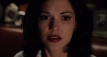 Movie still from “Mulholland Drive” (2001), directed by David Lynch – A person with dark hair; Close Up shot, High angle
