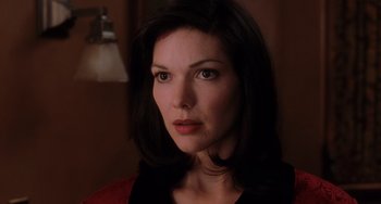 Movie still from “Mulholland Drive” (2001), directed by David Lynch – A person wearing a black shirt; Close Up shot, Over the shoulder angle