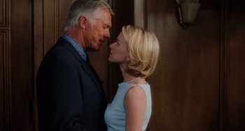 Movie still from “Mulholland Drive” (2001), directed by David Lynch – A man and a woman standing next to each other in front of a door; Close Up shot, Low angle