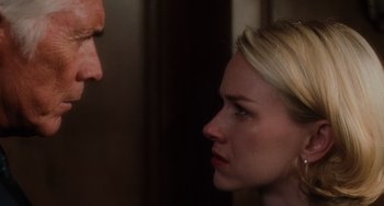 Movie still from “Mulholland Drive” (2001), directed by David Lynch – A woman looking at a man's face in a room; Close Up shot, Over the shoulder angle