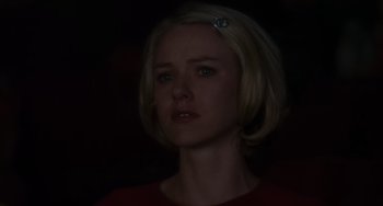Movie still from “Mulholland Drive” (2001), directed by David Lynch – A woman with blonde hair is looking at the camera; Close Up shot, Low angle