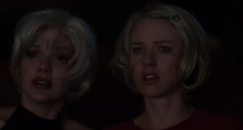 Movie still from “Mulholland Drive” (2001), directed by David Lynch – A woman crying in front of a mirror; Close Up shot, Low angle