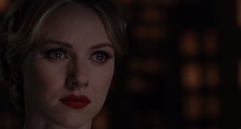 Movie still from “Mulholland Drive” (2001), directed by David Lynch – A person wearing a red lipstick; Close Up shot, Over the shoulder angle