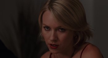 Movie still from “Mulholland Drive” (2001), directed by David Lynch – A person with blonde hair; Close Up shot, Over the shoulder angle