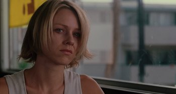 Movie still from “Mulholland Drive” (2001), directed by David Lynch – A person sitting in a car; Close Up shot, Over the shoulder angle