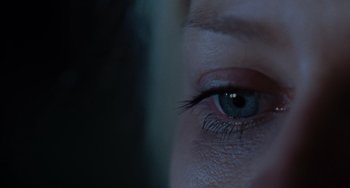Movie still from “Mulholland Drive” (2001), directed by David Lynch – A woman's eye with a dark background; Extreme Close Up shot, Overhead angle