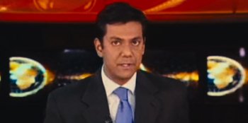 Movie still from “Mumbai Mafia: Police vs the Underworld” (2023), directed by Raaghav Dar – A person wearing a suit and tie; Close Up shot, High angle