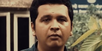 Movie still from “Mumbai Mafia: Police vs the Underworld” (2023), directed by Raaghav Dar – A person wearing a blue shirt; Close Up shot, Low angle