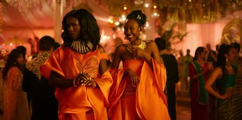 Movie still from “Murder Mystery 2” (2023), directed by Jeremy Garelick – A couple of women standing next to each other; Medium shot, Low angle