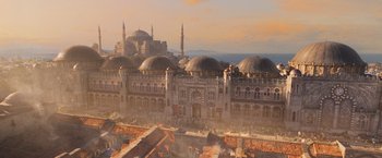 Movie still from “Murder on the Orient Express” (2017), directed by Kenneth Branagh – An aerial view of a city with a mosque in the background; Extreme Wide shot, High angle